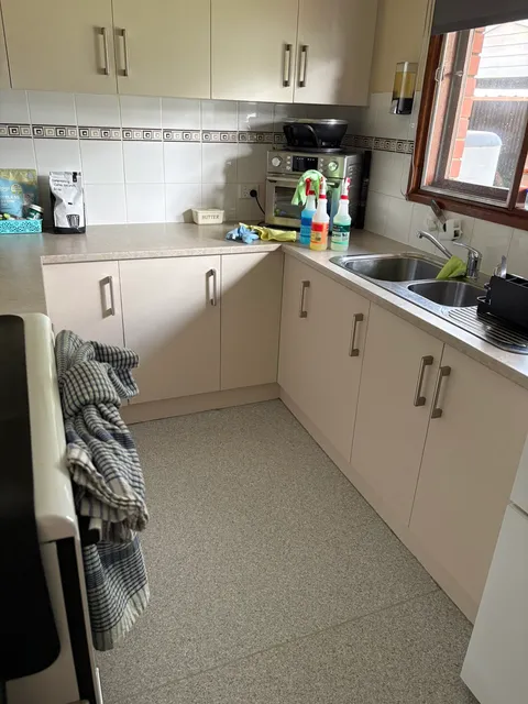Kitchen sink, benchtop and cupboards after a clean